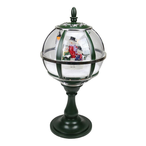 23.5" Lighted Green and Silver Musical Snowing Snowman Christmas Table Top Street Lamp